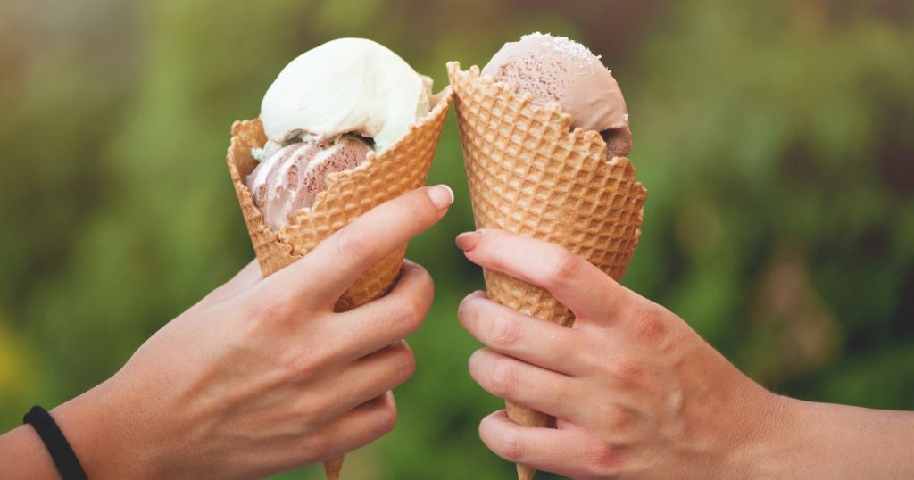 two hands holding ice cream for themed summer mailer