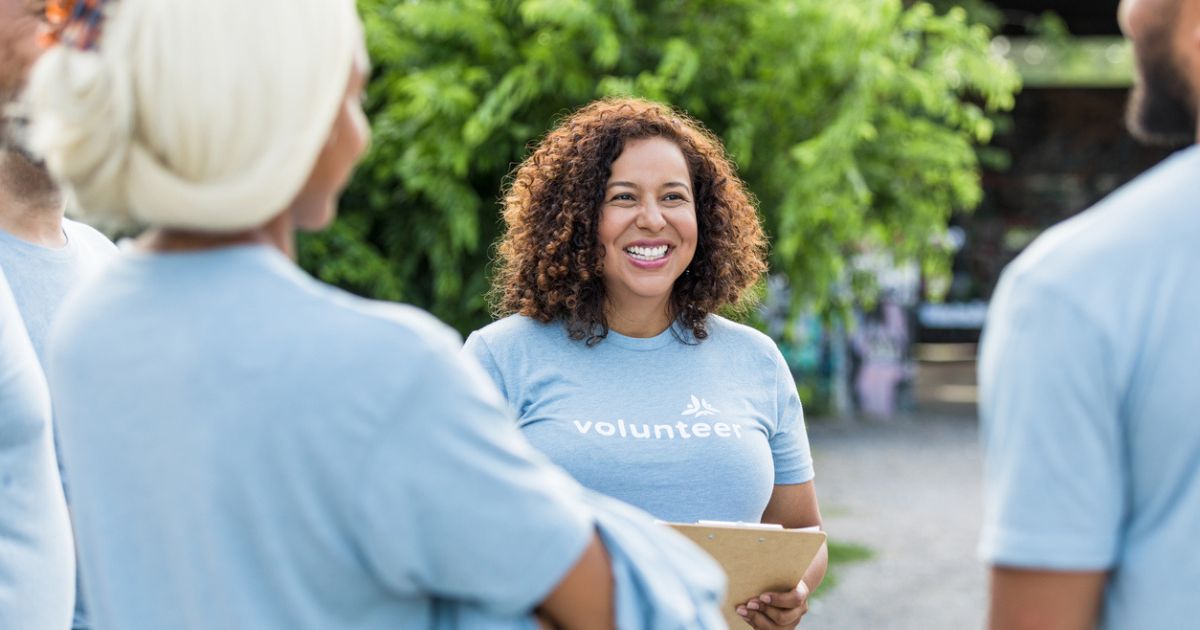 Woman motivated to volunteer at a nonprofit due to elevated brand equity.