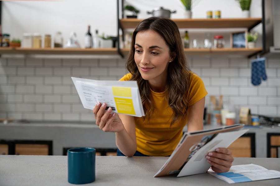 Woman at home checking her mail